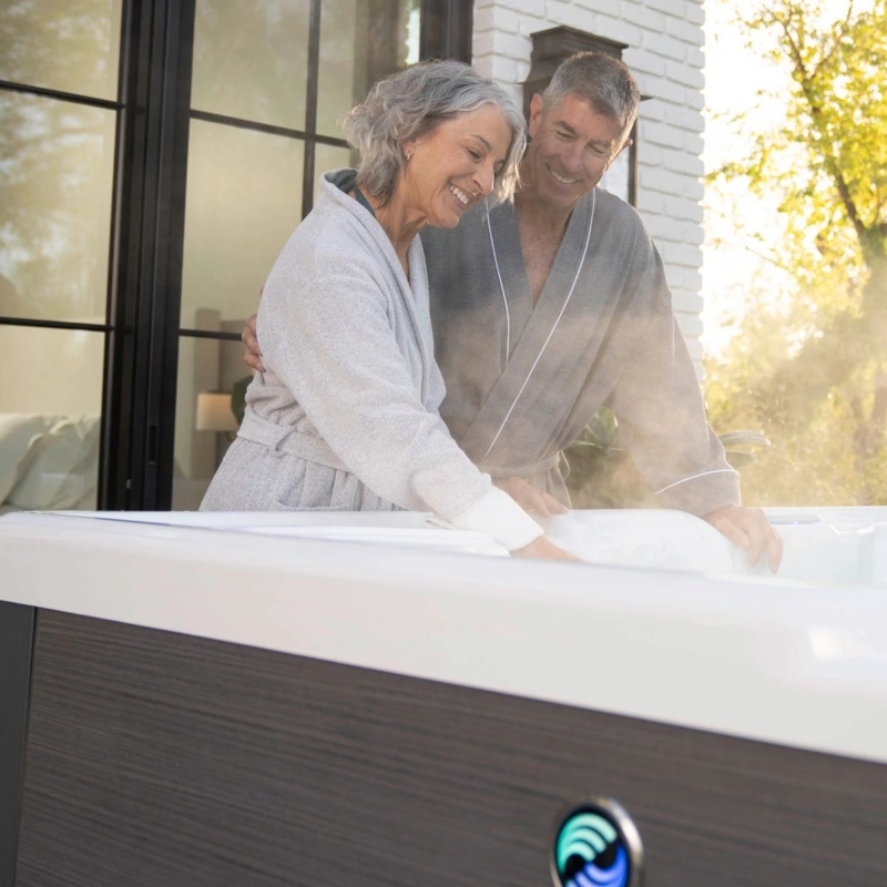 hot spring highlife aria alpinewhite charcoal older couple touching water 1